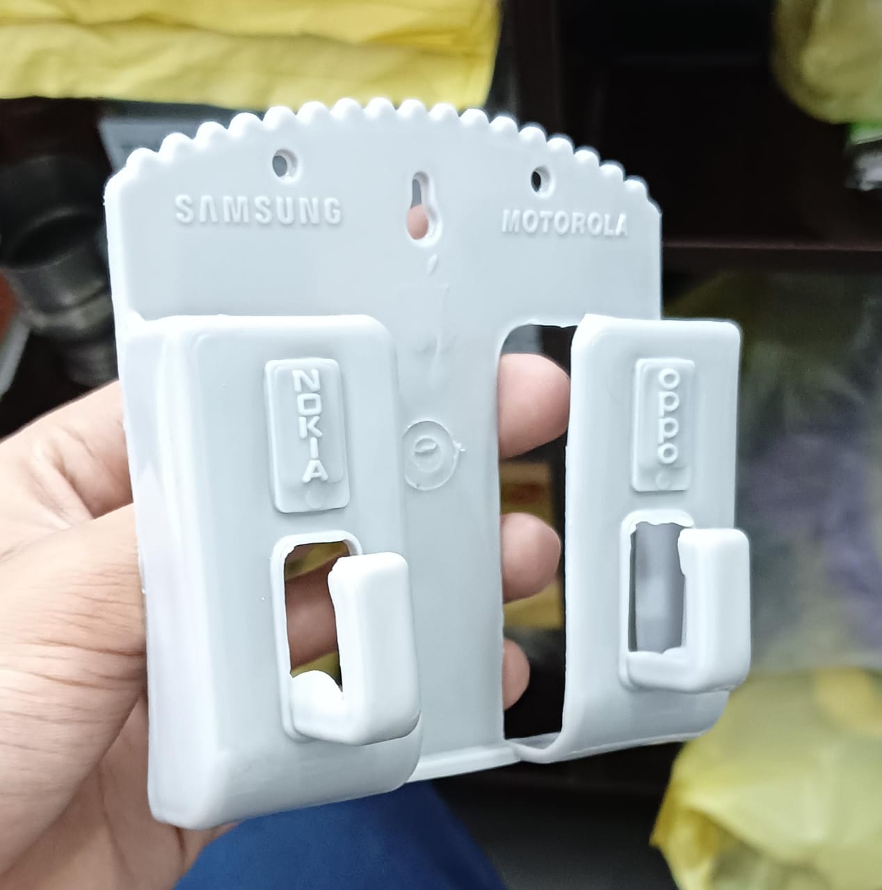 Multifunction Punch Free Wall Mounted Mobile Holder.